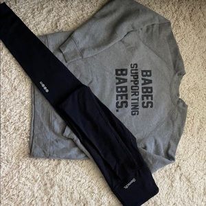 Grey sweater and Black leggings.